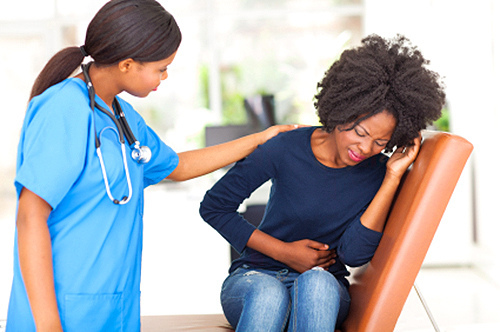 patient with food poisoning being consulted by a doctor